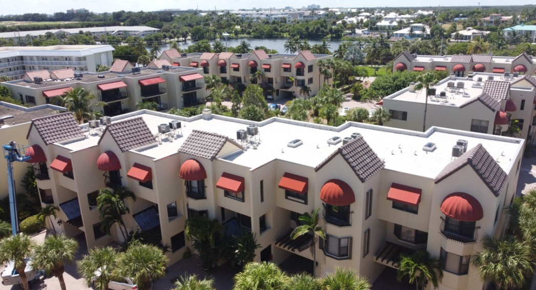 Roof Replacement HVAC stands at Cote Del La Mer Condos in Juno Beach FL by Crowther Roofing Sheet Metal Jupiter