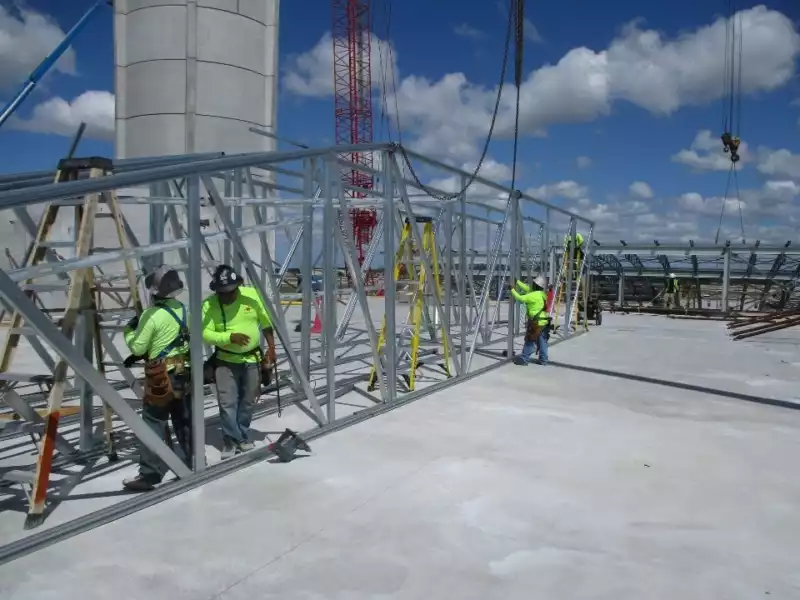 Light Gauge Metal Trusses being installed at RSW in Fort Myers by Crowther Roofing and Cooling