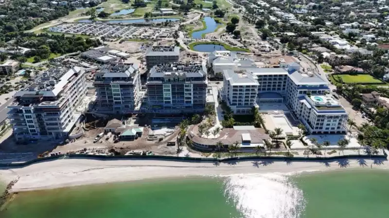 Naples Beach Club gulf view of roof replacement by Crowther Roofing Cooling serving Fort Myers Sarasota Jupiter